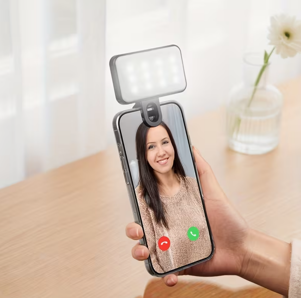 Clip-on phone fill light attached to smartphone for selfie