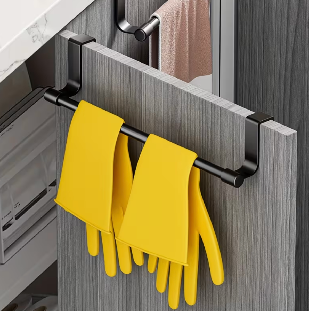 No-drill kitchen cabinet towel rack hooked over cupboard door