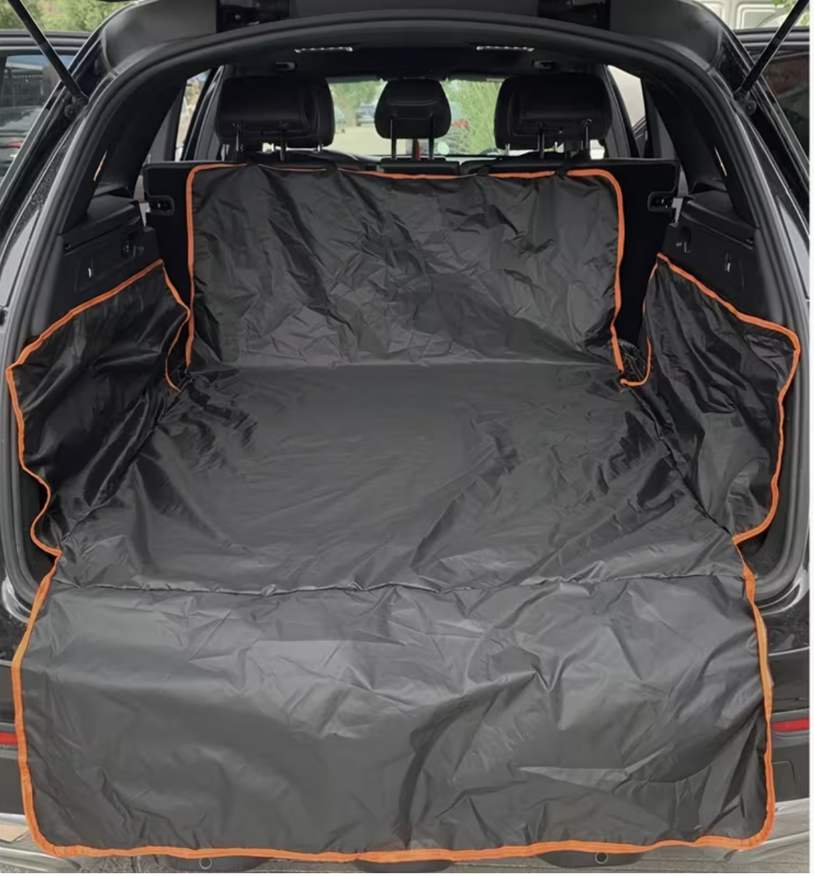 Dog standing on waterproof car trunk liner