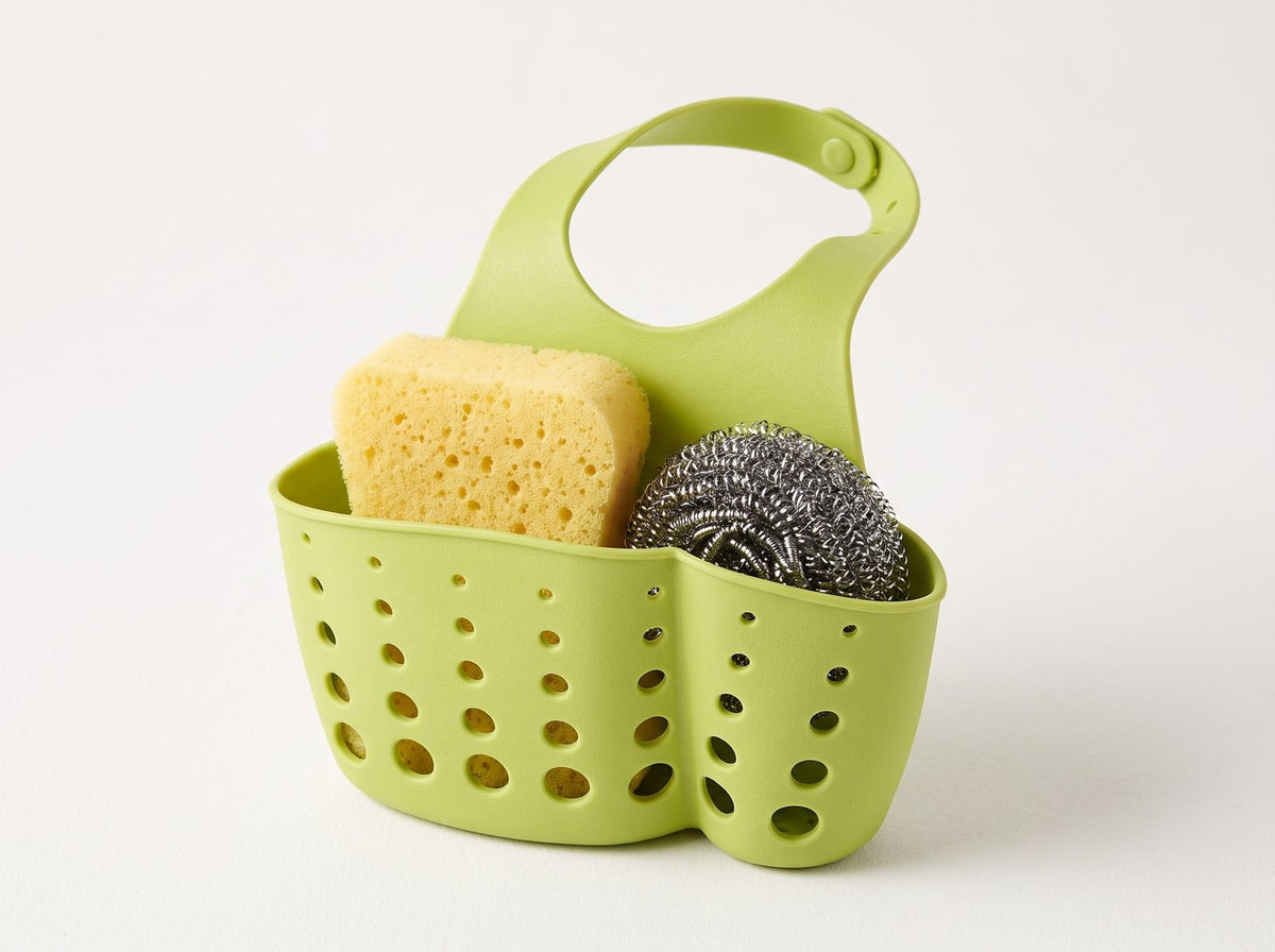 Green silicone sink caddy sponge holder on a white background